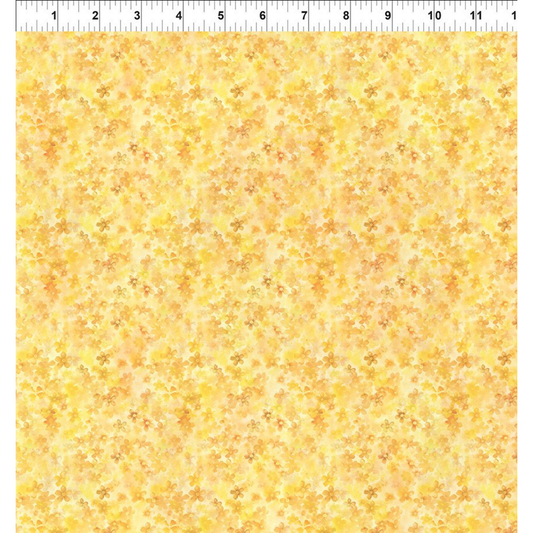 Yellow floral patterned fabric with a ruler for scale