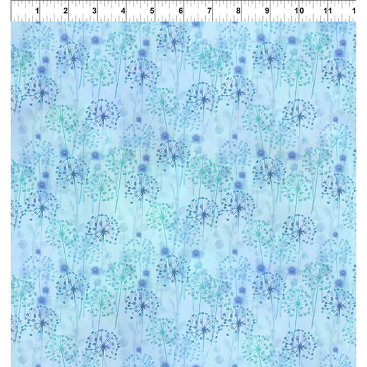 Pattern of blue and turquoise dandelions on a light blue background with a ruler for scale