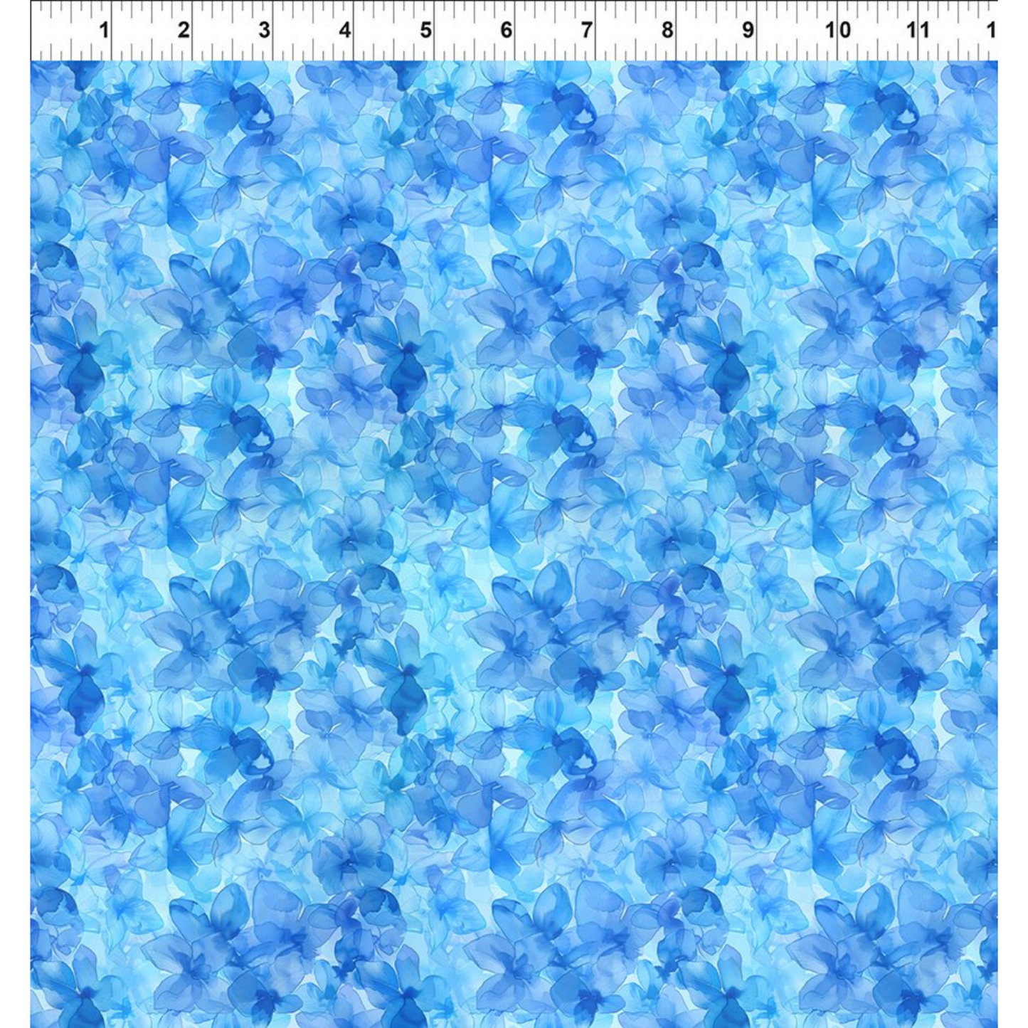 Blue floral pattern on a blue background with a ruler for scale