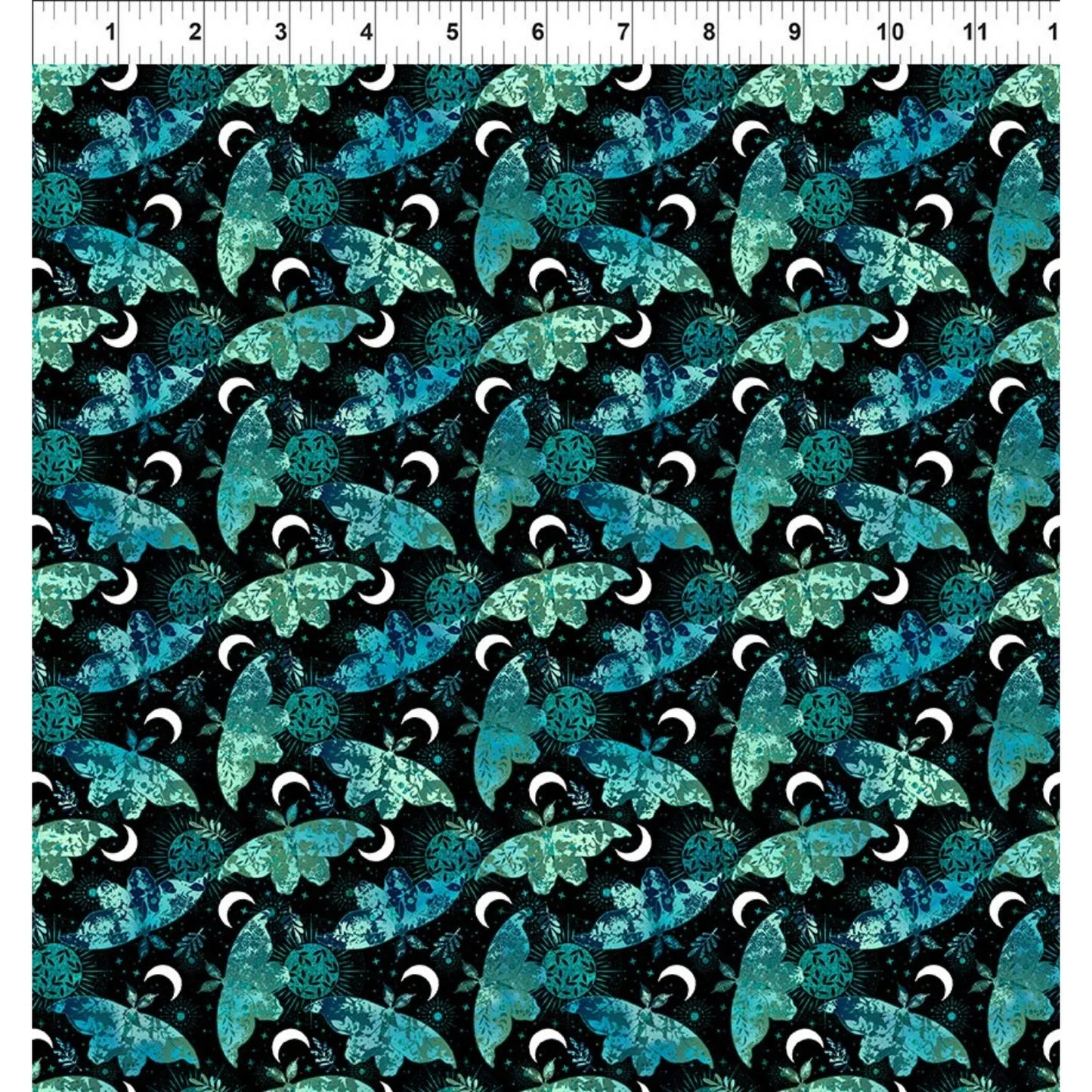 Pattern of blue and green moths on a black background with a ruler for scale.