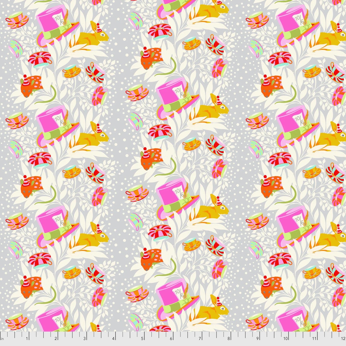 Patterned fabric with colorful mice, teacups, and top hats on a grey background with a ruler for scale