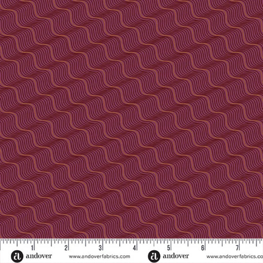 A repeating pattern of wavy diagonal lines in rose gold and black on a rich burgundy-red background. Ruler at the bottom for scale.
