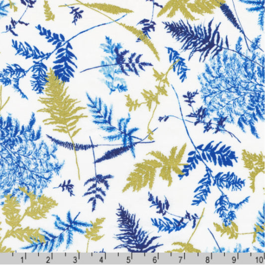 Pattern of blue and gold sprigs on a white background with a ruler for scale