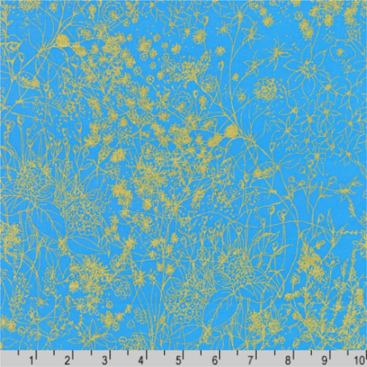 Floral pattern with gold outlines on a blue background with a ruler for scale