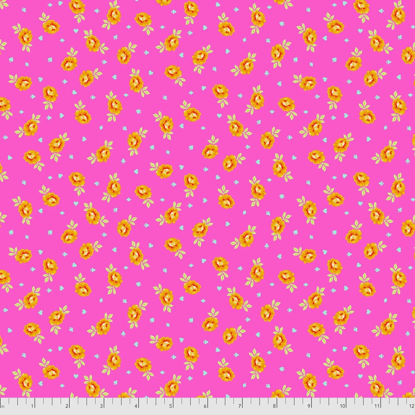 Pink fabric with yellow floral pattern ith a ruler for scale