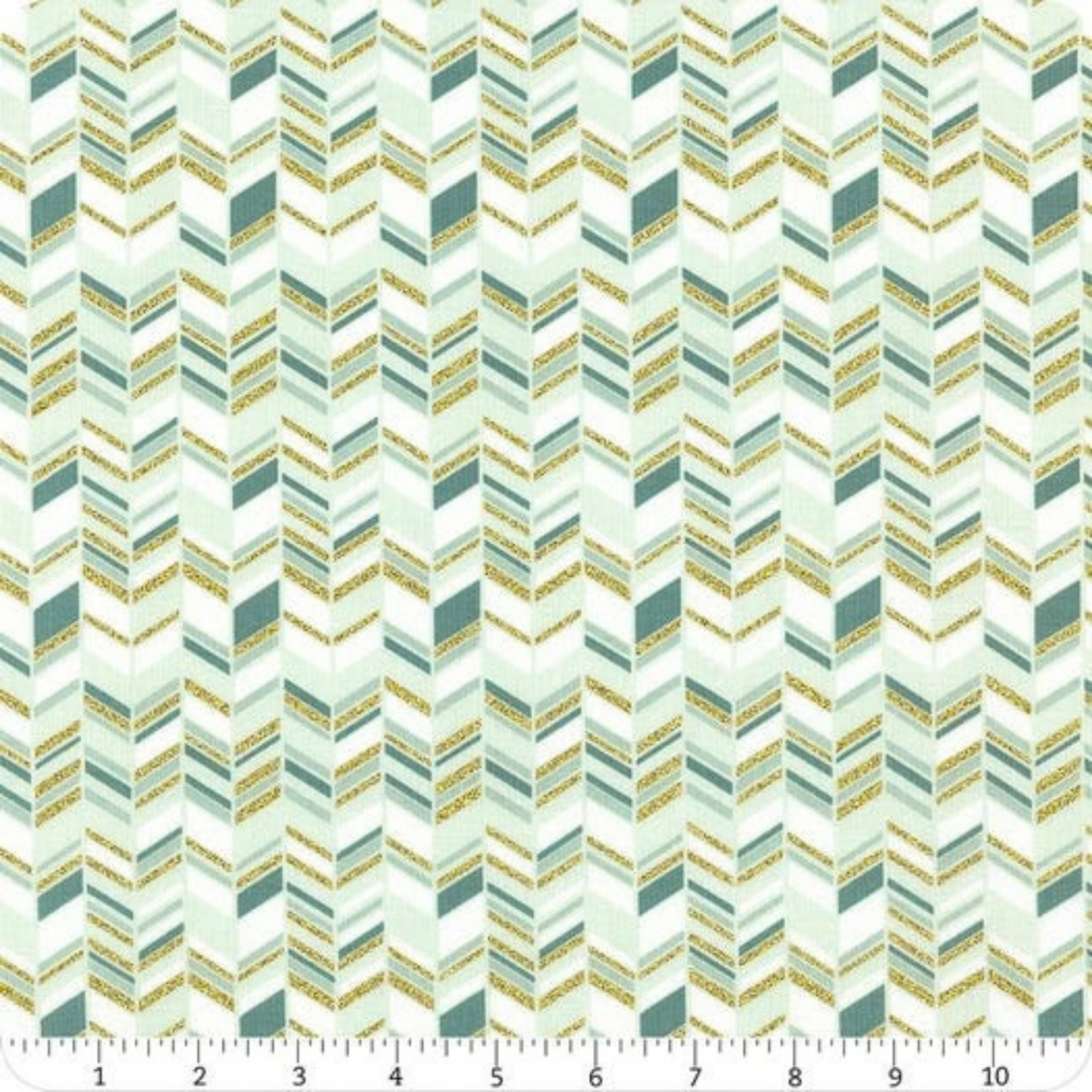 Patterned fabric with a zigzag design in teal and gold tones with ruler for scale