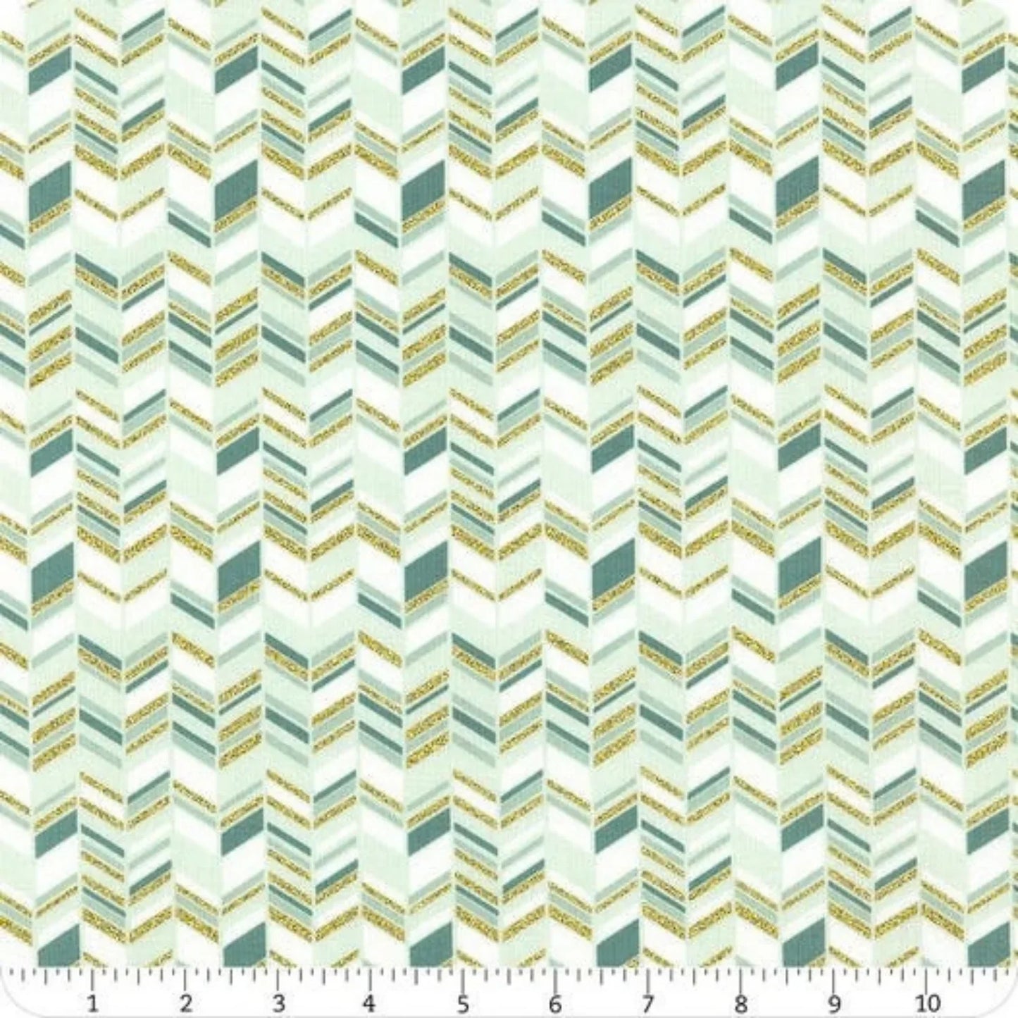 Patterned fabric with a zigzag design in teal and gold tones with ruler for scale