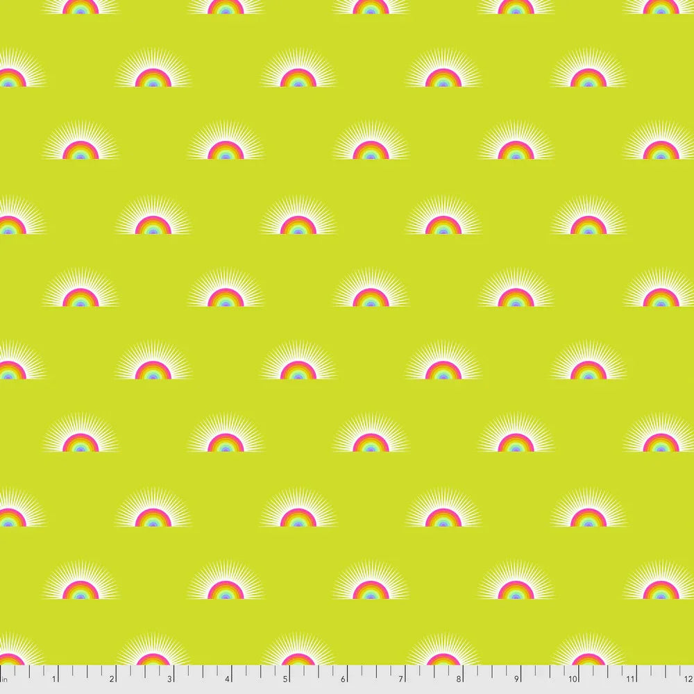 Pattern of rainbows on a yellow background with a ruler for scale