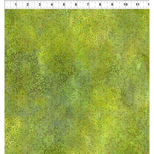 A fabric design featuring overlapping lotus flowers, awash in lush chartreuse, radiant gold, and deep olive hues with a ruler at the top for scale.