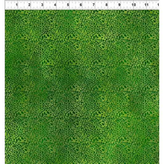 A fabric design featuring intricate botanical vines and leaves, woven in blended shades of deep, harmonious greens with a ruler at the top for scale.