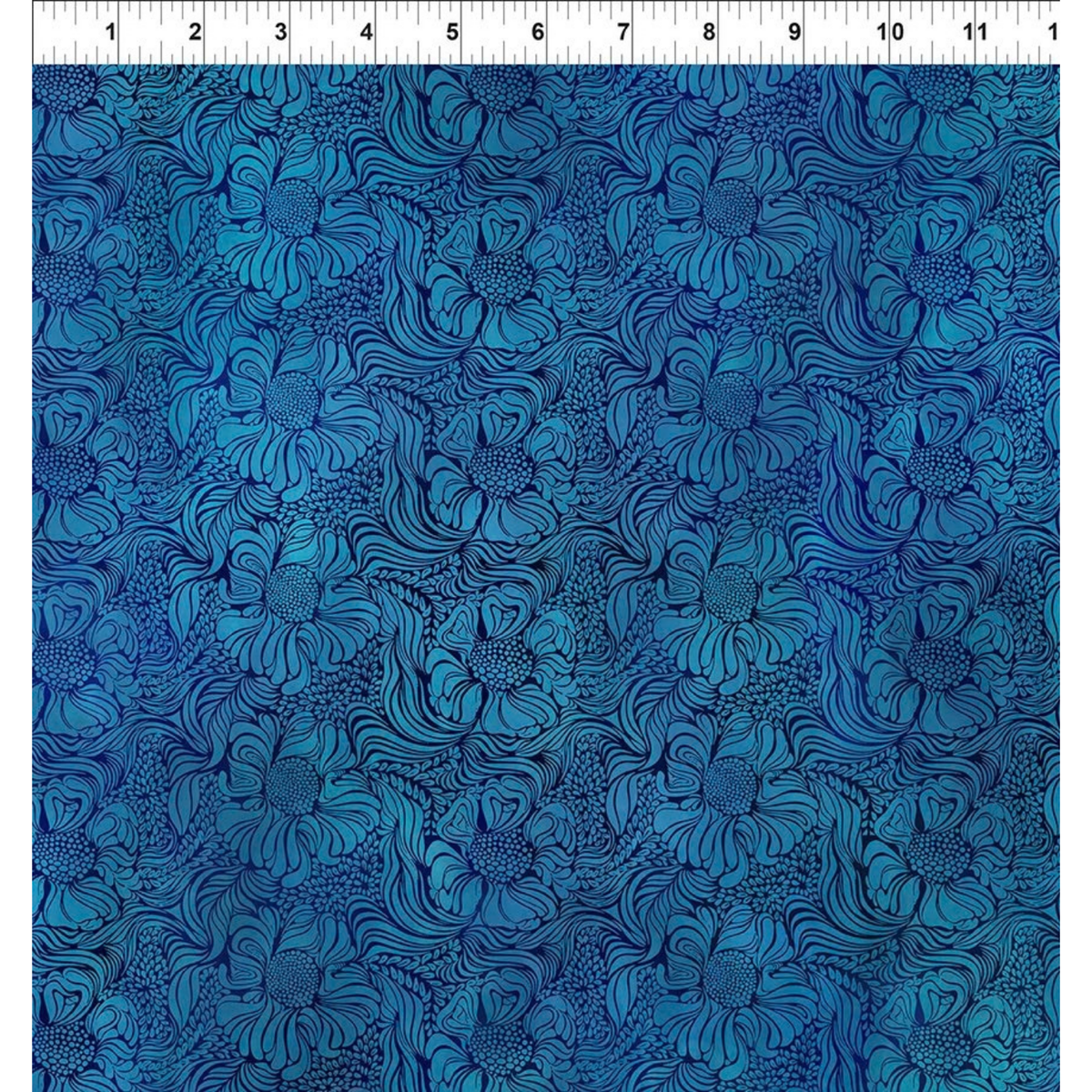 Fabric design featuring a repeating blue floral pattern with swirling leaf-like outlines and dotted accents, filling the entire frame. Ruler at the top for scale.