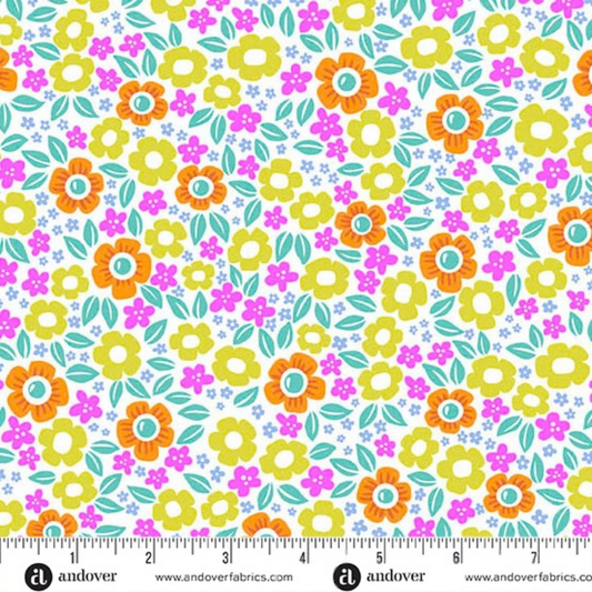 Orange, lime-green, magenta, and teal flowers on a white background with a ruler for scale