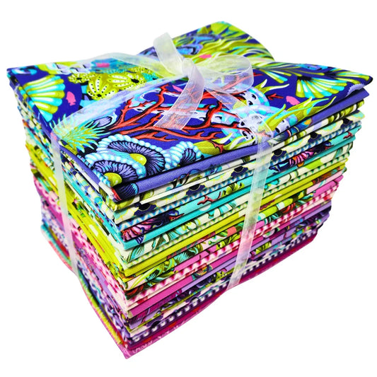 Bundle of colorful fabric squares tied with a ribbon on a white background