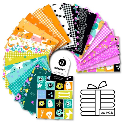 A fanned-out bundle of colorful fabric squares in vivid pinks, oranges, lime-greens, teals, and blacks, featuring Halloween motifs.