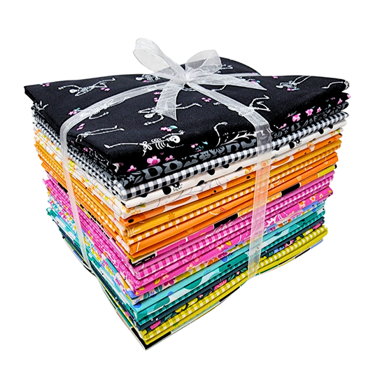 Bundle of colorful fabric squares tied with a ribbon on a white background