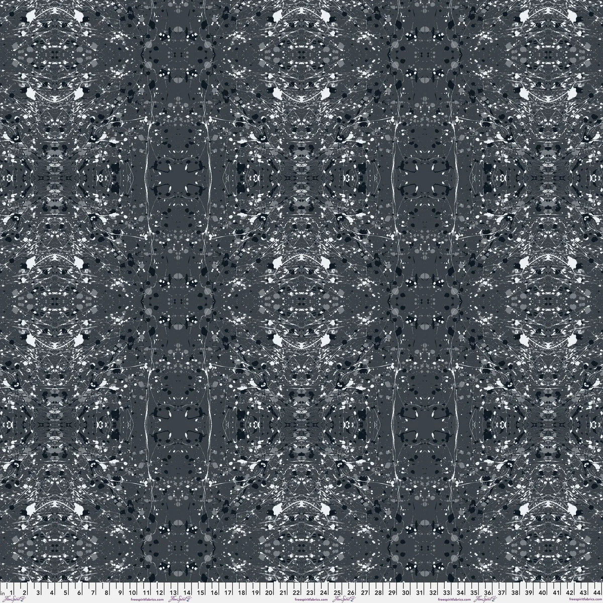 A seamless abstract fabric pattern featuring symmetrical, kaleidoscopic motifs in black, grey, and white, with a ruler at the bottom for scale.