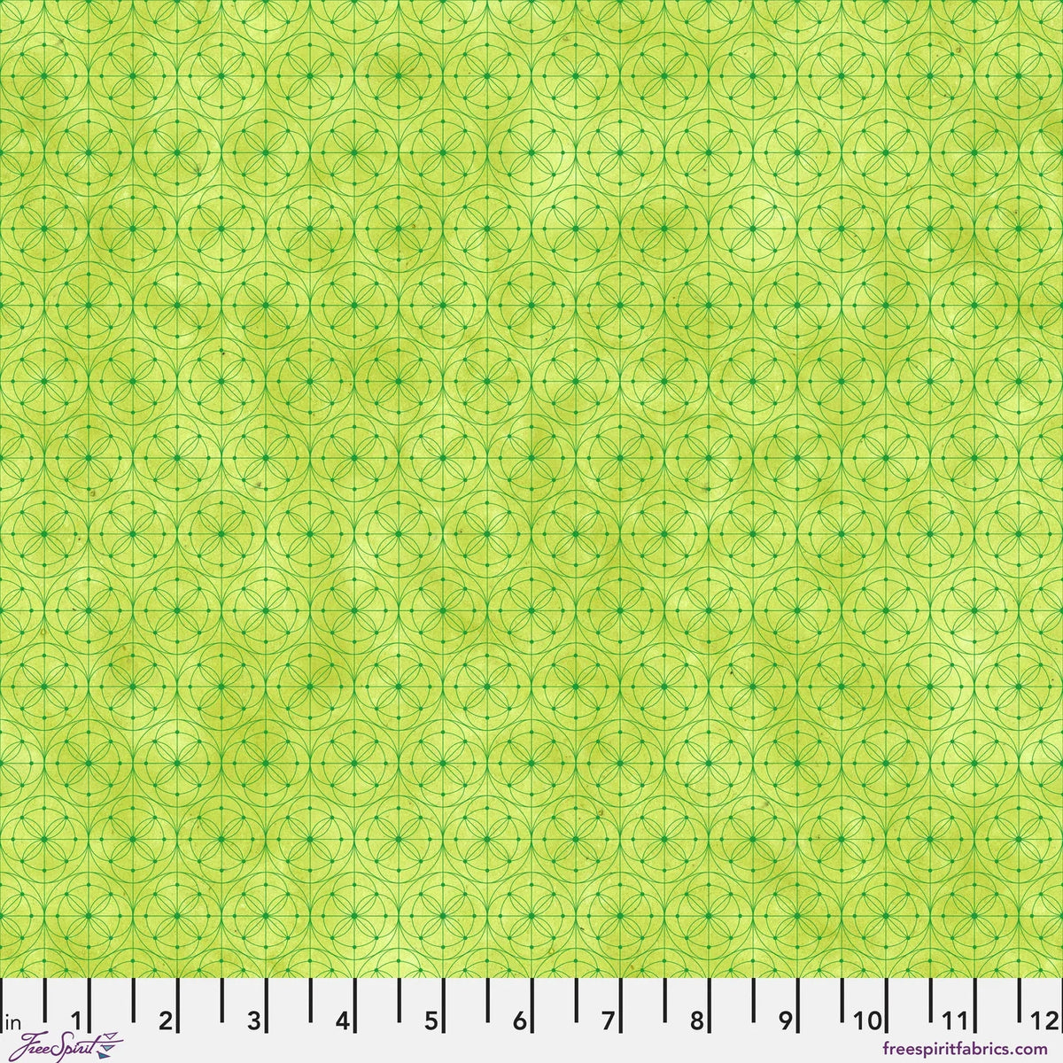 Fabric pattern featuring a repeating geometric design of interlocking circles and stars in lime green with a ruler along the bottom edge for scale.