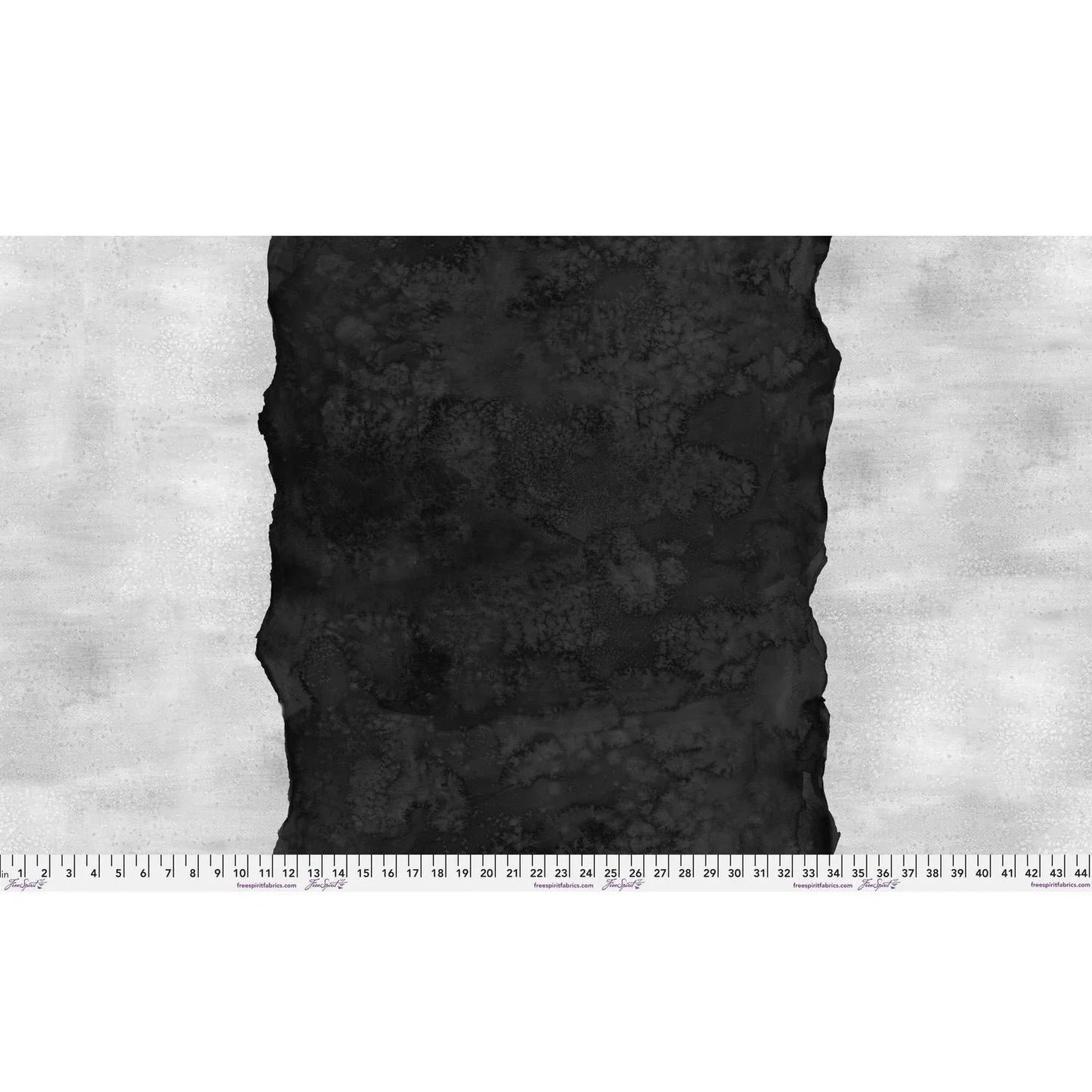 Abstract fabric pattern with a watercolor-like texture featuring a central stripe of inky black and outer light grey edges. Ruler at the bottom for scale.
