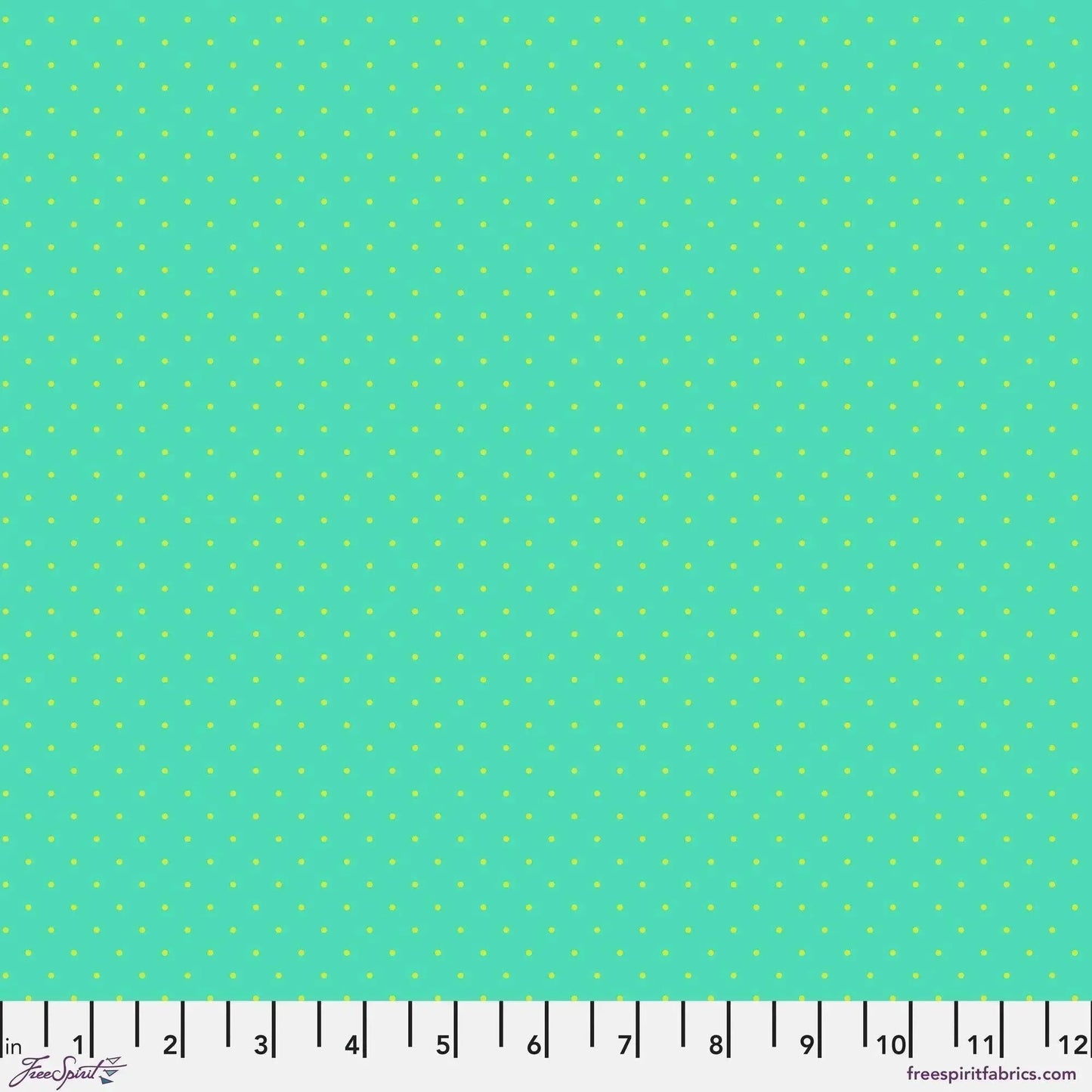 Small lime green polka dots on a turquoise background with a ruler for scale