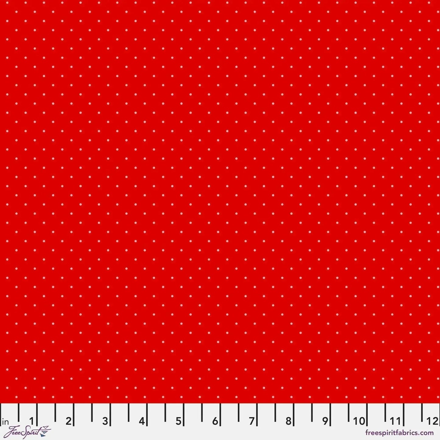 Tiny light-pink polka dots on a bright red background with a ruler for scale