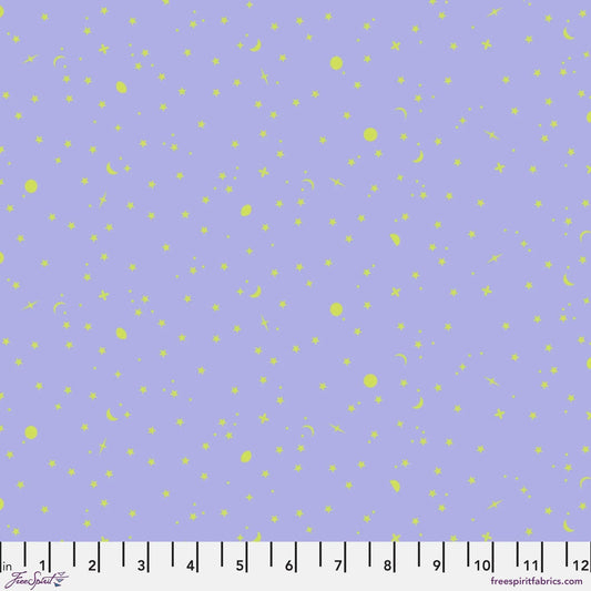tiny lime-green stars, moons, and dots tossed across a periwinkle background with a ruler for scale