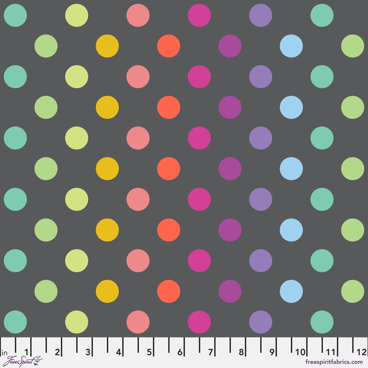 A repeating pattern of colorful polka dots in arranged on a dark gray background with a ruler at the bottom for scale.
