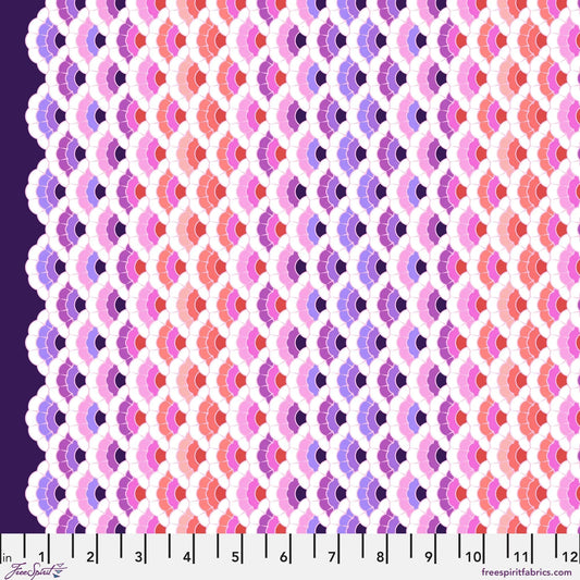 Geometric pattern of overlapping scalloped shapes with pink, coral, red, and purple colors on a dark background with a ruler for scale.