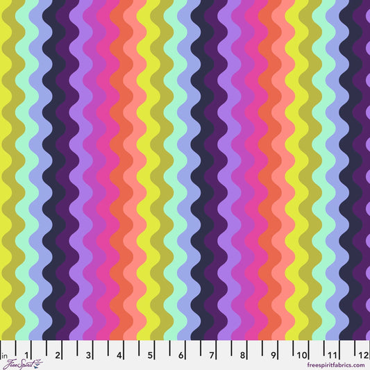 Pattern of undulating vertical waves in a rich, psychedelic sequence of colors, including chartreuse, mint, periwinkle, navy, lavender, magenta, pink, coral, and peach. Ruler at the bottom for scale.