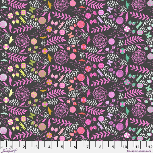 A seamless botanical pattern featuring stylized flowers, leaves, butterflies, feathers, and pinwheels in pink, purple, orange, yellow, and white on a dark charcoal black background. Ruler at the bottom for scale.