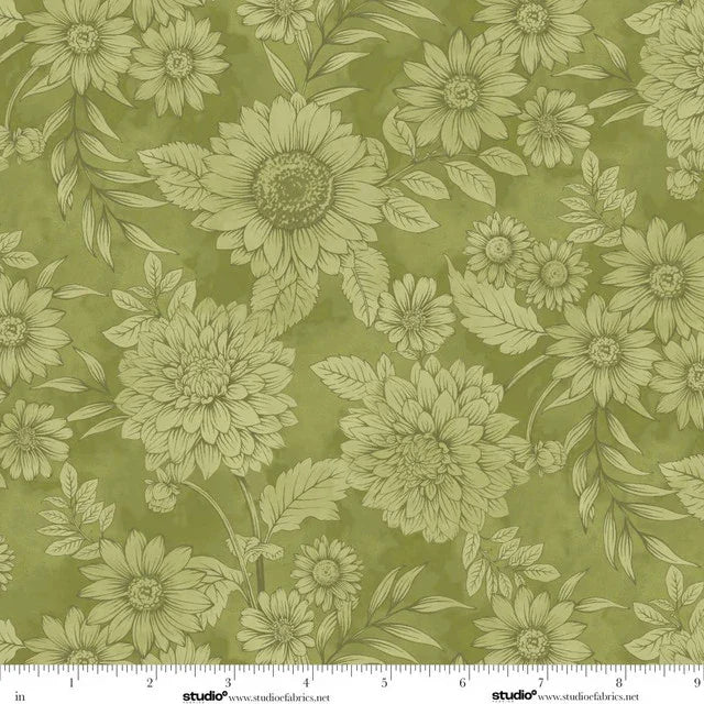 Floral pattern with green flowers and leaves on a green background with a ruler for scale.