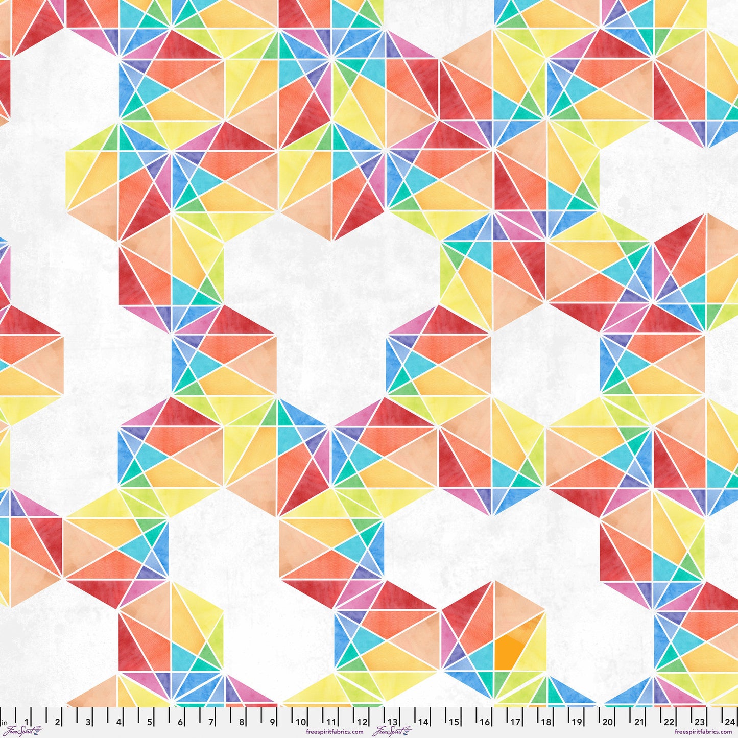 Fabric with a bold, graphic pattern of hexagons subdivided into vivid, multicolored triangles. Ruler at the bottom for scale.