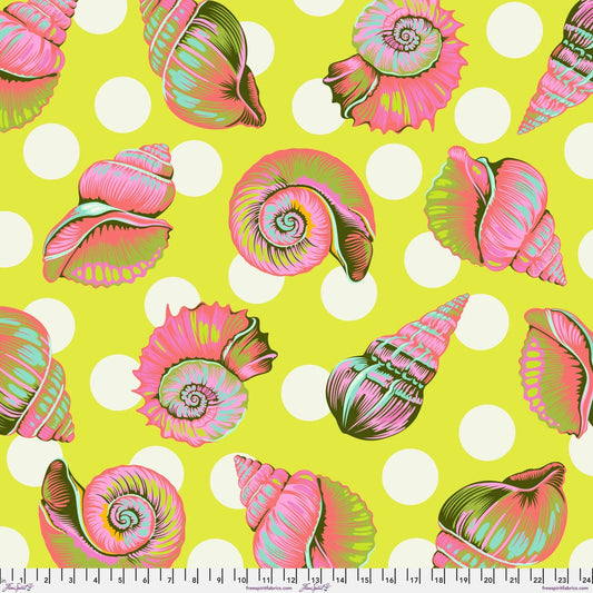 Colorful detailed shell pattern on a lime green background with white polka dots. Ruler at the bottom for scale.