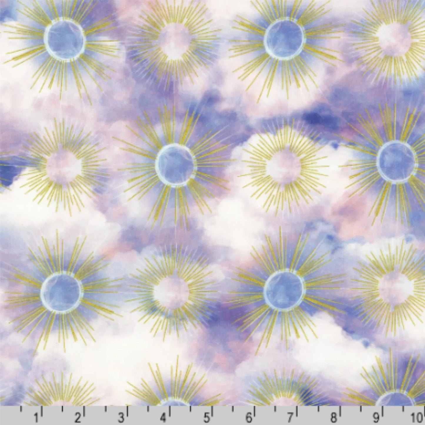 Pattern of sunburst designs with golden rays on a cloudy pastel purple background with a ruler for scale.