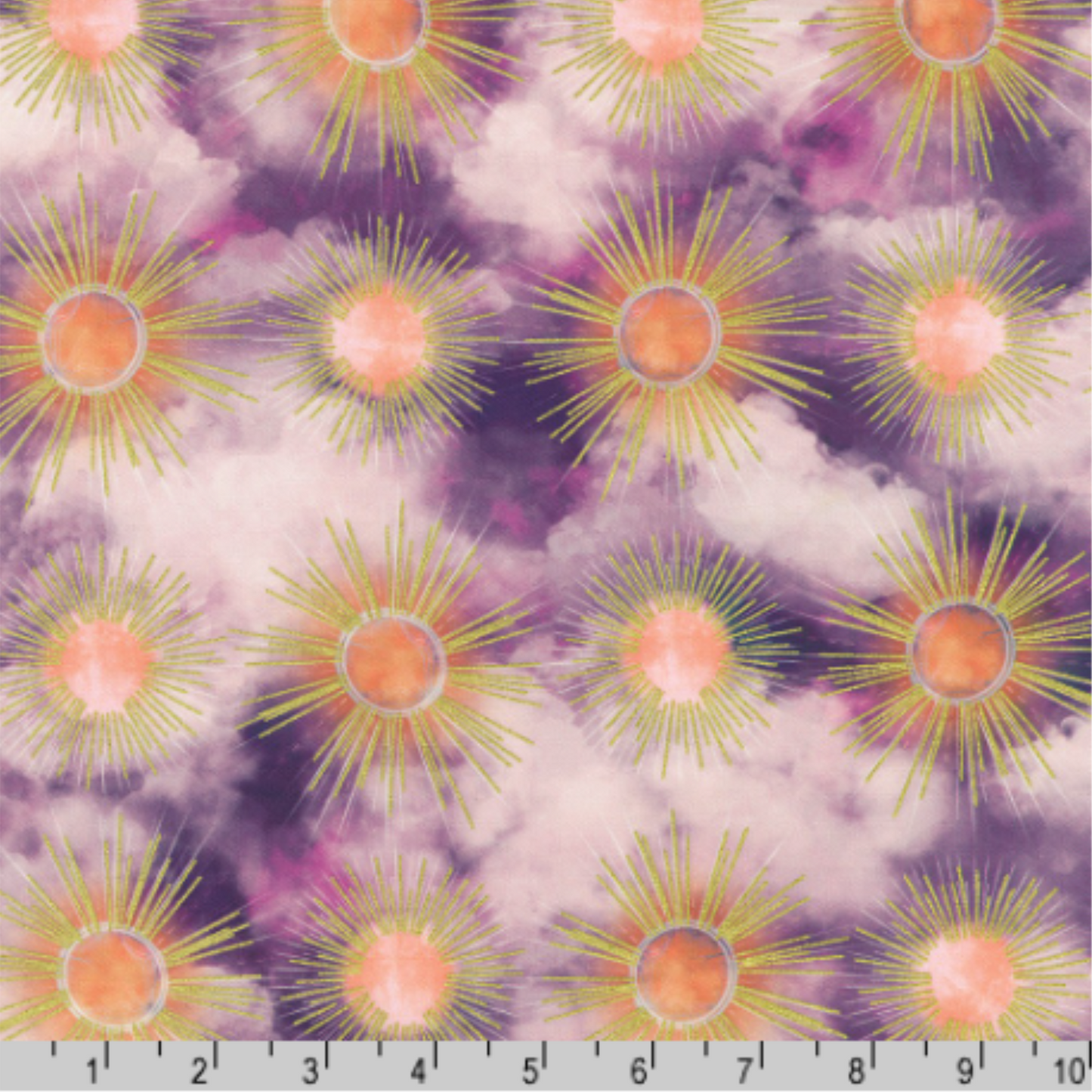 Pattern of sunburst motifs on a clouded background in deep violet, fuchsia, and soft lavender tones. Metallic golden rays radiate from pastel orange centers. Ruler for scale.