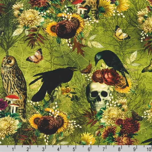 Macabre nature-themed fabric with crows, owls, flowers, skulls, moths, and spider webs on a lime-green background with a ruler for scale.