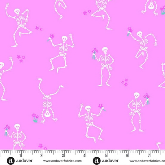 Pattern of dancing skeletons on a pink background with a ruler for scale.