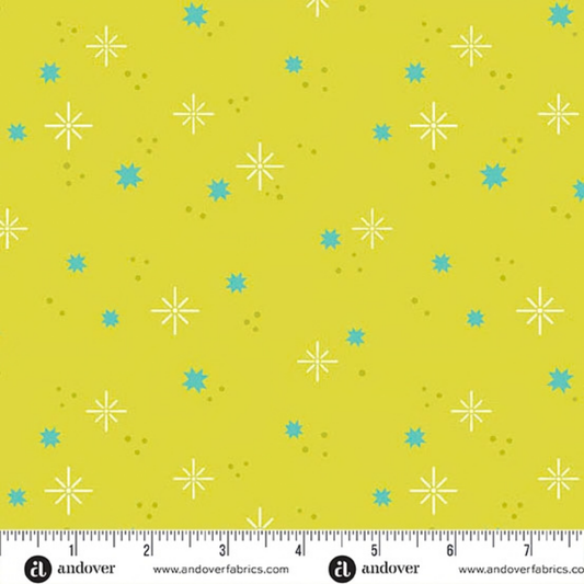 Pattern of aqua stars and olive-green dots on a yellow-green background with a ruler for scale.