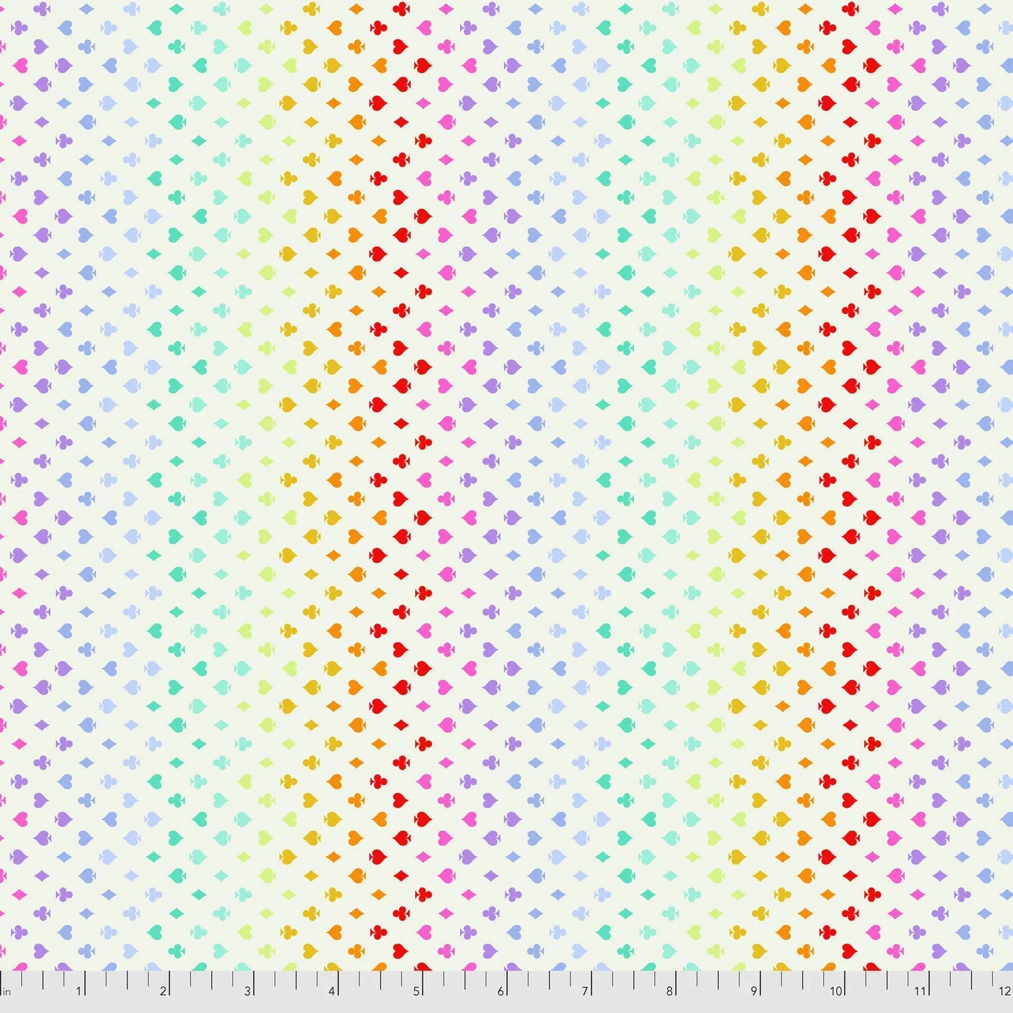 Colorful pattern of small card suite symbols on a cream background with a ruler for scale