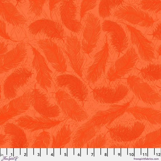 Pattern of red-orange feathers on a textured orange background with a ruler for scale.