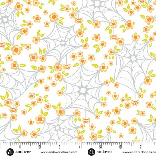 Pattern of cartoon-like spider webs and orange flowers on a white background with a ruler for scale