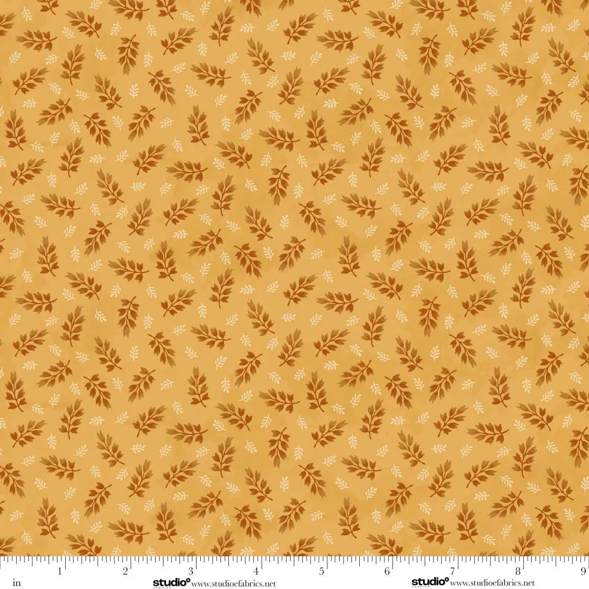 Pattern of small leaves on a golden background. Ruler at the bottom for scale.