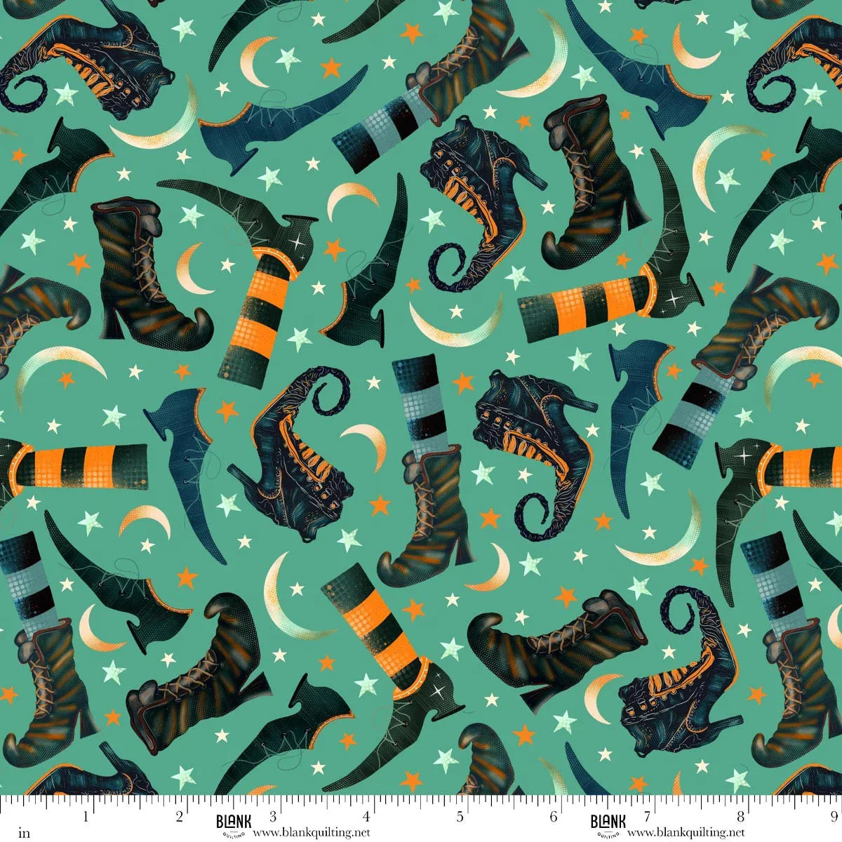 Pattern of witch boots, striped stockings, crescent moons, and stars on a teal background. Ruler for scale.