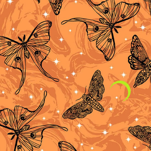 Black line-art moths on an orange background with a green crescent moon.