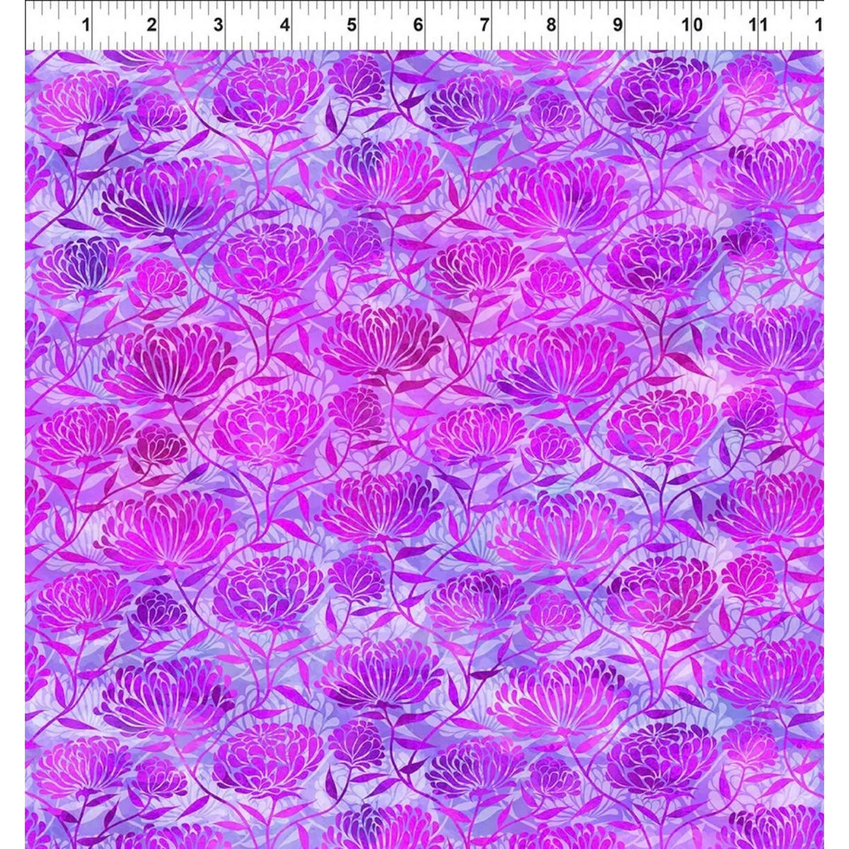 A fabric swatch with an allover floral pattern in shades of purple, magenta, and pink over a pale lavender background. A ruler at the top edge indicates the scale of the print.