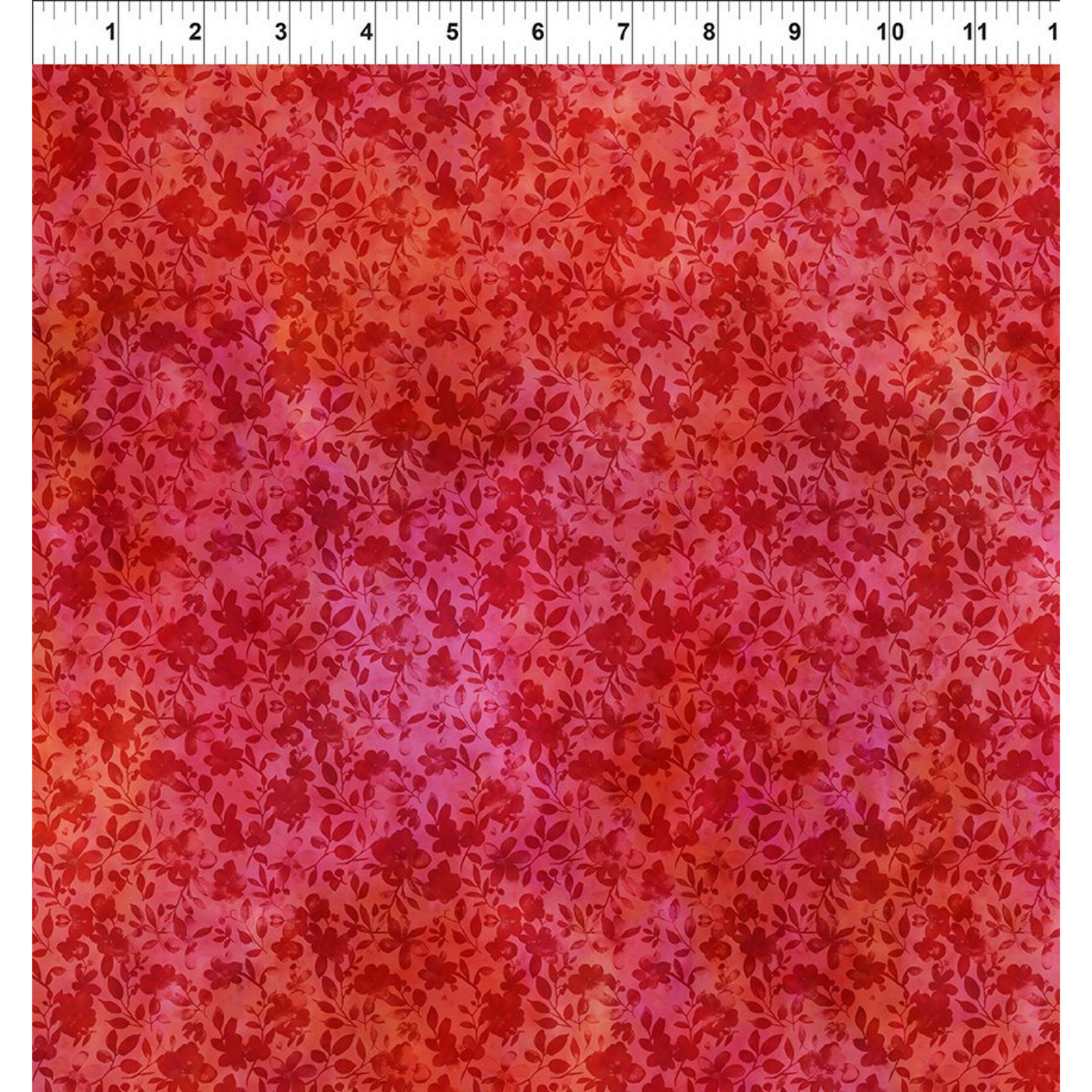 Red floral patterned fabric with a ruler at the top for scale.