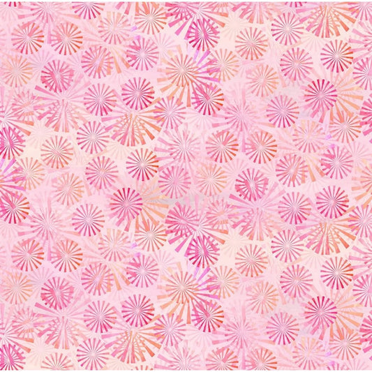 A repeating watercolor-style pattern of pink and coral sunburst motifs on a pale pink background.