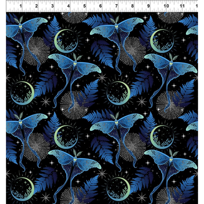 Pattern of blue lunar moths and green moons on a black background with a ruler for scale