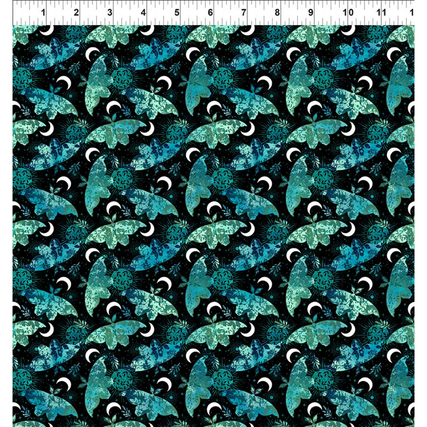 Pattern of blue and green moths on a black background with a ruler for scale.