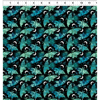 Pattern of blue and green moths on a black background with a ruler for scale.