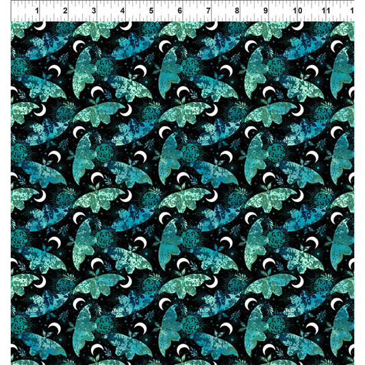 Pattern of blue and green moths on a black background with a ruler for scale.